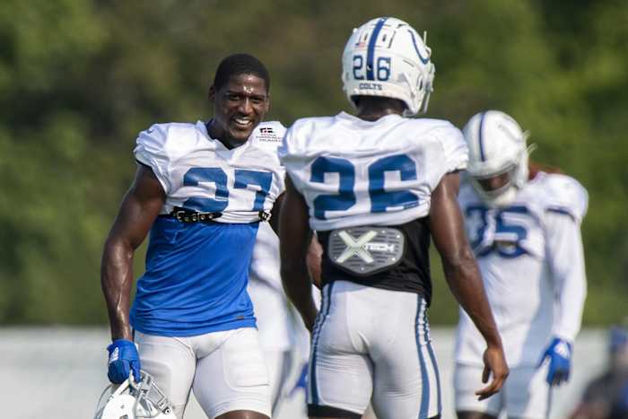 Indianapolis Colts cornerback Xavier Rhodes (27) interacts with cornerback Rock Ya-Sin during training camp.